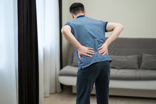 istock Back pain, kidney inflammation, man suffering from backache at home 1495599827