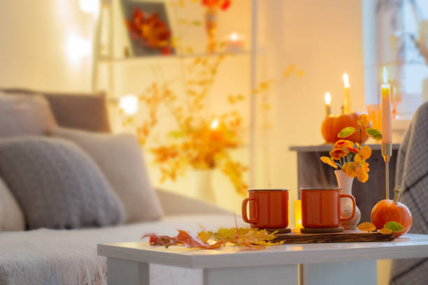 istock two orange cups with hot drink in autumnal interior 1495602431