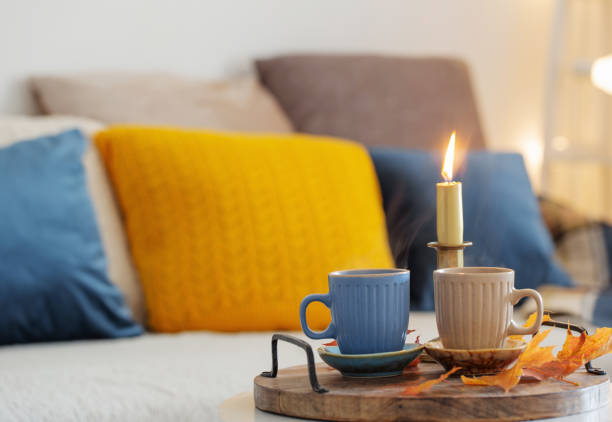 istock two  cups with hot drinks at home with autumnal decor 1495602453