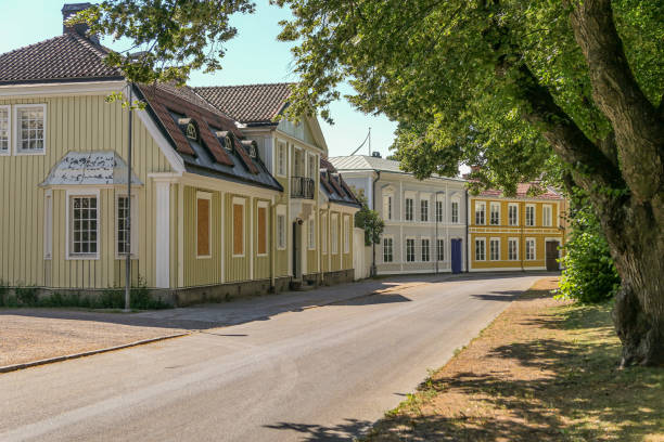 istock Empty road by buildings in a city 1495604983
