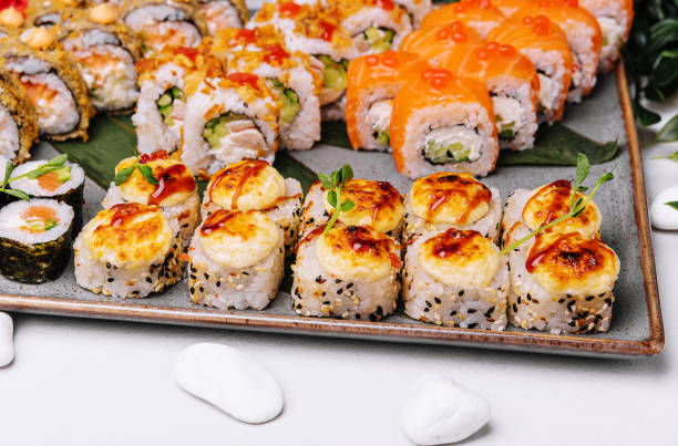 istock different types of sushi rolls on big plate 1495606364