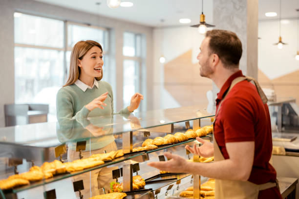istock Male Baker With Female Customer 1495606402