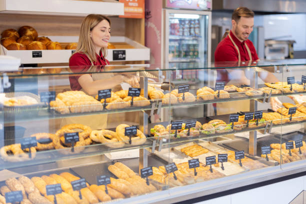 istock Pastry Man and Woman Working Together 1495606694