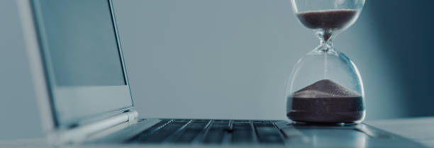 istock Laptop and hourglass 1495606825