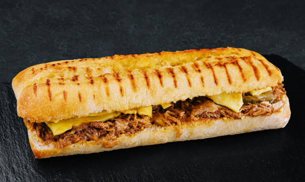 istock long sandwich with chicken, cucumbers and cheese 1495609656
