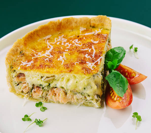 istock Tart with salmon and spinach on white plate 1495611910