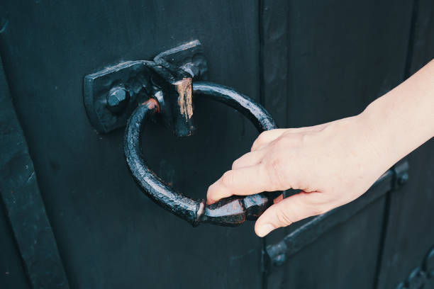 istock Female hand opens an ancient door 1495611992