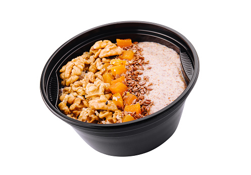 Bowl of granola isolated on white