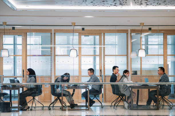 istock Multiracial group of Asian people work in co-sharing office open plan 1495616039