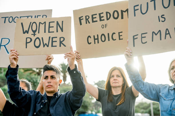 istock Group of diverse protesters with placards 1495618923