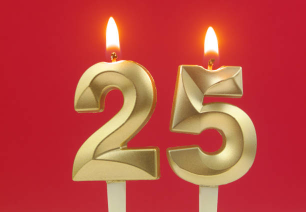 istock Birthday candles on red background, number 25 1495619107
