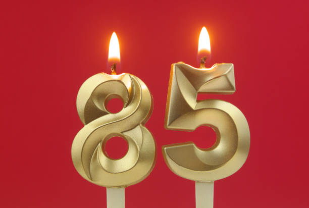 istock Birthday candles on red background, number 85 1495619150
