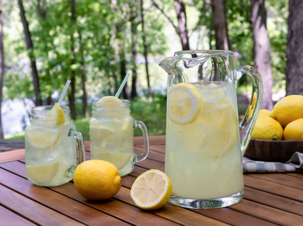 istock Pitcher of lemonade outdoors on wooden table 1495621517