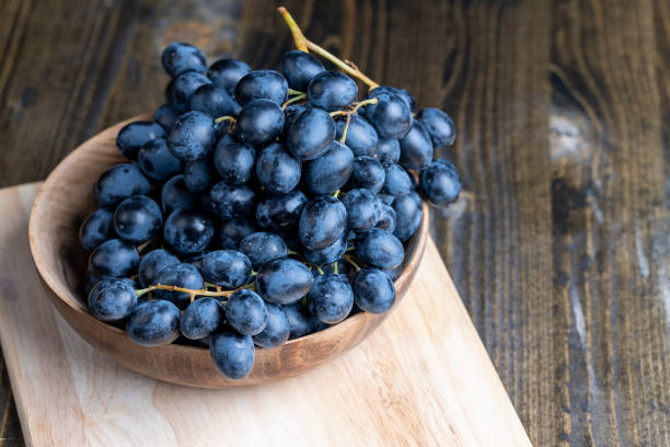 istock Blue grapes grown in a home vineyard 1495621724