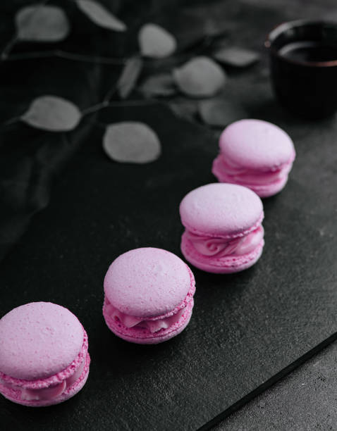 Delicate crumbly delightful pink macaroons close up