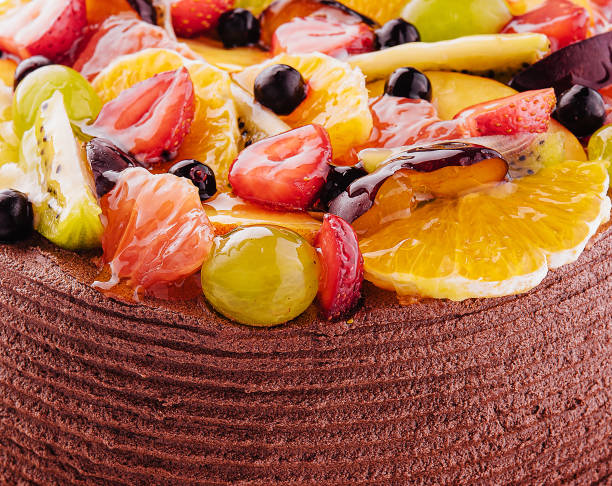 chocolate cake decorated berries and fruits closeup