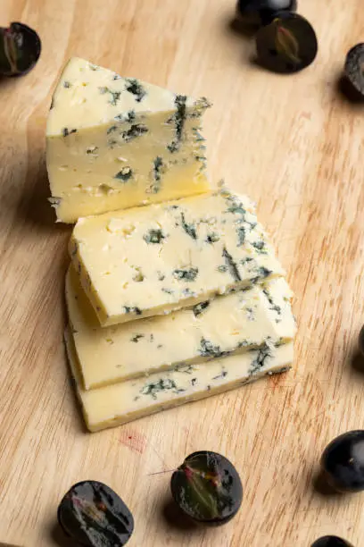 Photo of Cheese with blue mold cut into pieces