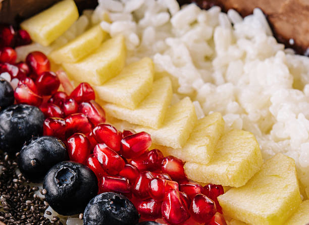 istock bowl of rice, pineapple, pomegranate and blueberries 1495622865
