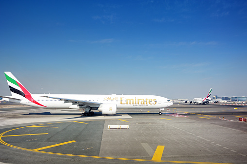 Dubai, United Arab Emirates - November 2, 2012: Emirates Boeing 777-200 take off at Dubai International Airport Terminal