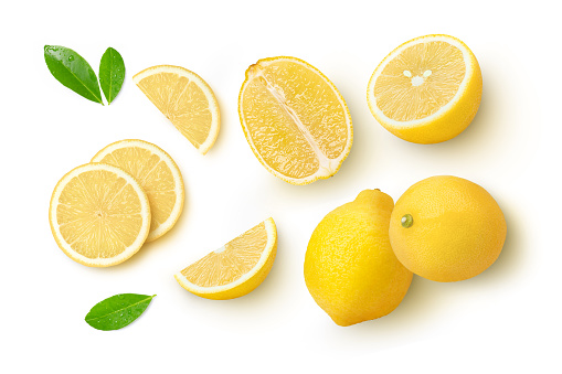 Whole and slices of lemon and green leaf  isolated on white background, top view, flat lay.