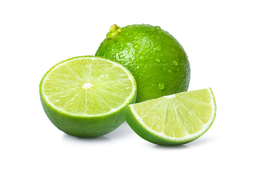 Fresh lime fruit with cut in half slice isolated on white background.