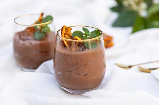 Delicious chocolate mousse dessert with caramelized oranges served in a glass cup - Argentine culture - Buenos Aires - Argentina