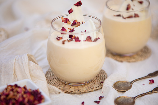 Turkish rice pudding sutlac, turkish dessert on wooden table.