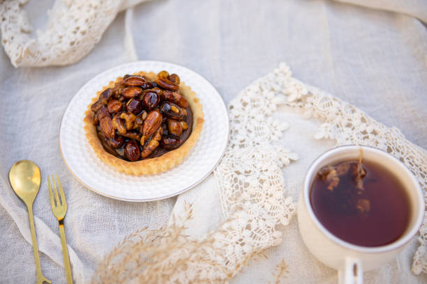 Delicious dulce de leche and caramelized dried fruits pie with tea - Argentine culture - Buenos Aires - Argentina