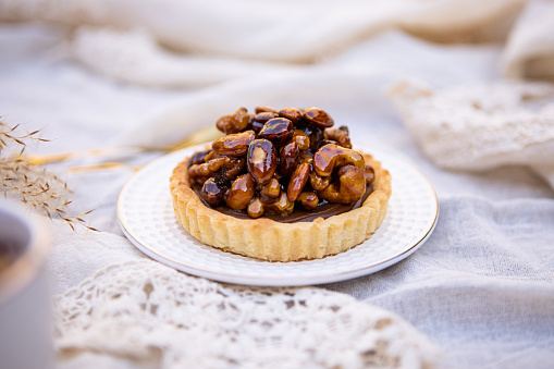 Delicious dulce de leche and caramelized dried fruits pie with tea - Argentine culture - Buenos Aires - Argentina