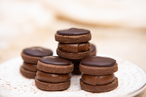 Delicious butter and chocolate alfajores filled with dulce de leche - Buenos Aires - Argentina