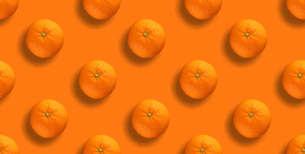 istock Seamless pattern of citrus fruit - orange on orange background. Fresh repeating orange fruit on orange background 1495639441