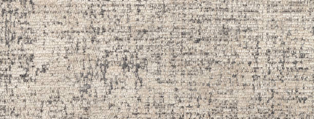 istock Texture of light beige color background from fluffy textile material with wicker pattern, macro. 1495641939