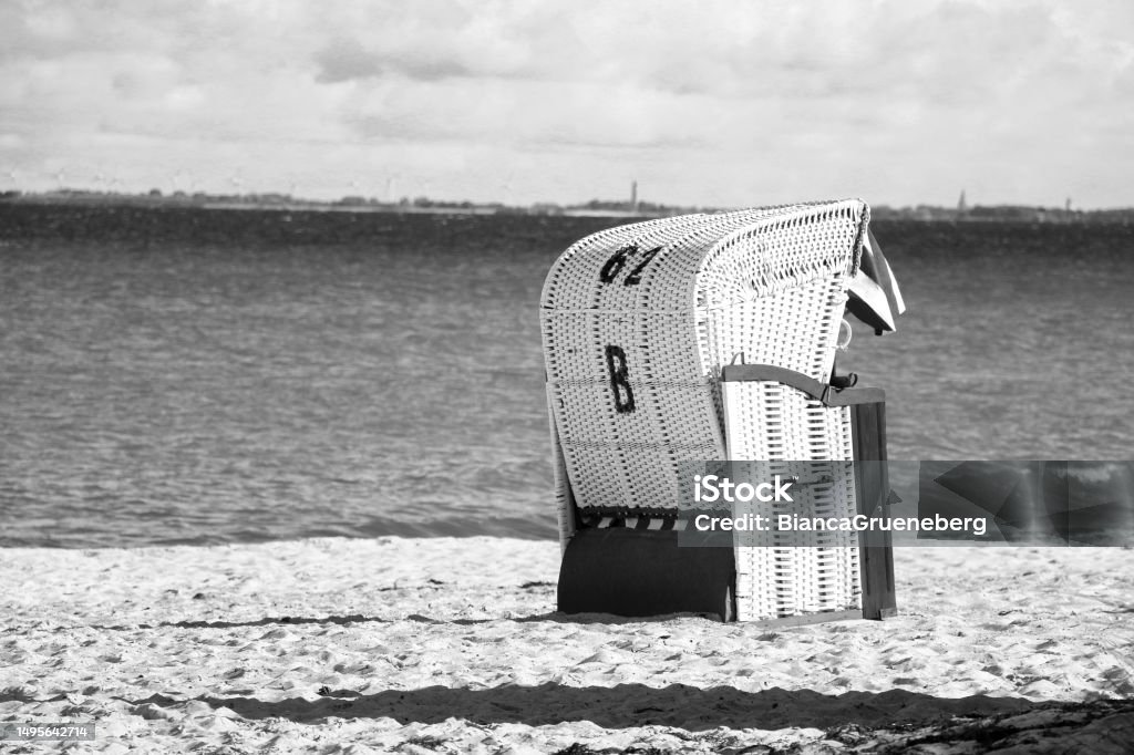a black and white closeup of a beach chair on the beach black and white closeup of a beach chair on the beach Backgrounds Stock Photo