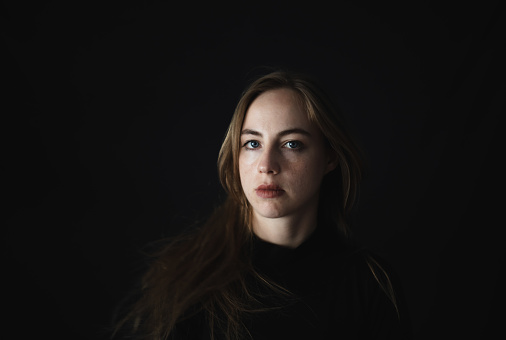 A woman portrait in photo studio.