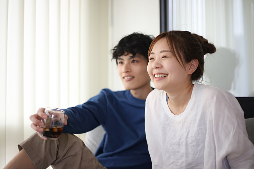 couple watching sports on tv
