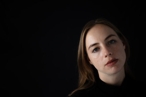 A woman portrait in photo studio.