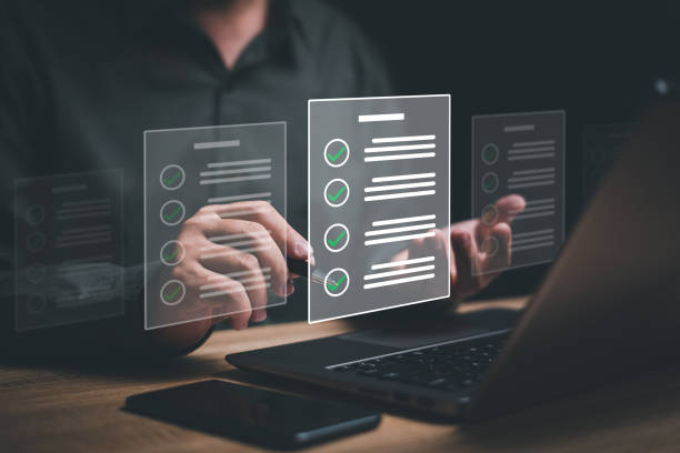 istock Smart checklist and document management on virtual screens concept, Businessman use pen checkmarks on e-document automate operations, customer service management business strategy 1495647706