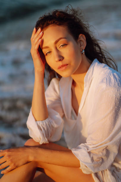 istock Beautiful woman  walking at a beach at sunset. 1495648095