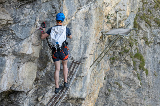 istock Young man on Via Ferrata crossing obstacles 1495649142