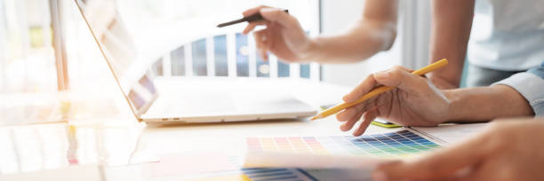 istock Group of startup team coworking with new creative project plan. 1495649692
