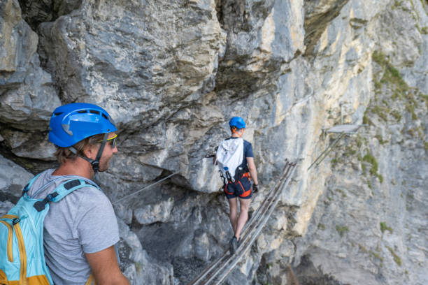 istock Two men on Via Ferrata climbing up a rock face 1495649877