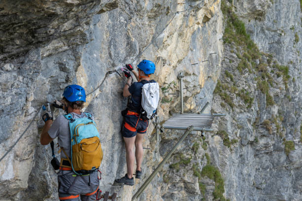 istock Two men on Via Ferrata climbing up a rock face 1495650061