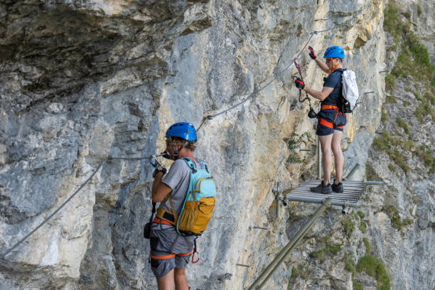 istock Two men on Via Ferrata climbing up a rock face 1495650230