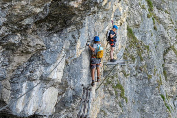 istock Two men on Via Ferrata climbing up a rock face 1495650322