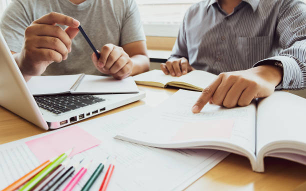 istock Mentor training colleagues discuss with student. teacher and education concept 1495656674