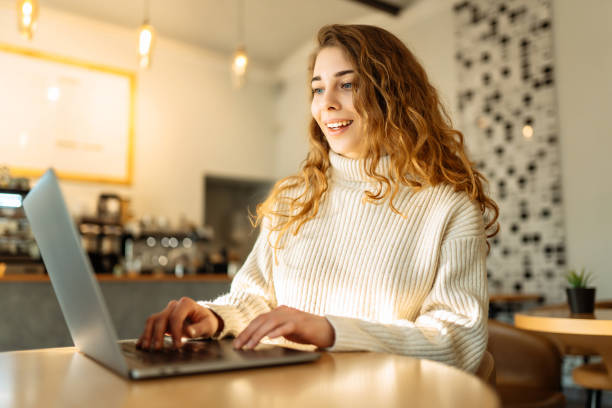 istock Young woman with laptop at home. 1495657128