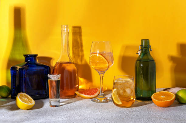 istock Various alcoholic cocktails on yellow background with sunlight shadows. Summer cocktails menu. Summer alcoholic cocktails for party. Hard light and shadow pattern 1495657438