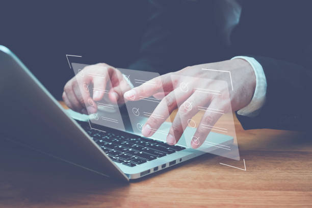 istock Business performance checklist, Quick checklist and clipboard management concept, job applicants, businessman using laptop doing online checklist survey,Employees must complete the online survey form. 1495658398