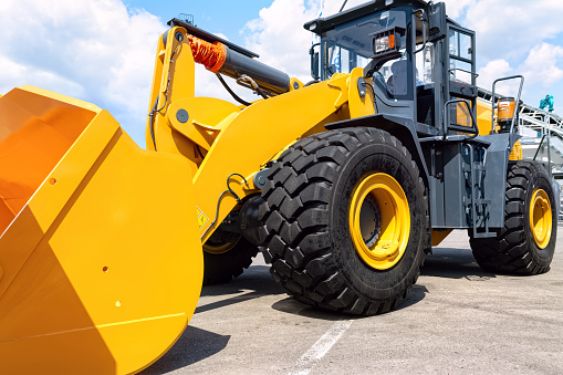 Powerful yellow new front loader.