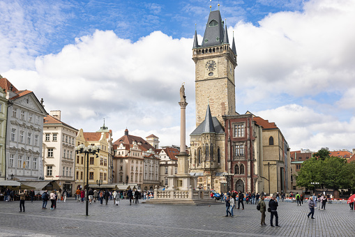 Prague, CZECH REPUBLIC - May 17th, 2023: The main square Staroměstské náměstí in Prague with the city hall, marian column and tourists.